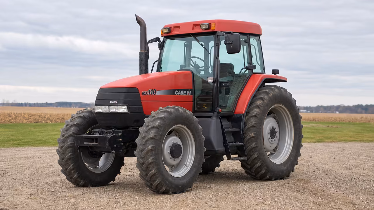 Red Case IH MX110 Maxxum tractor on a gravel farm drive.
