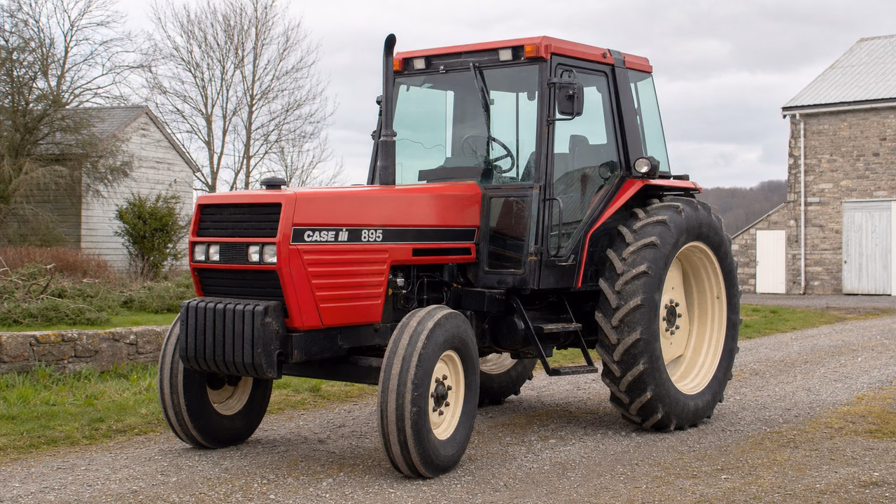 Case IH 895 tractor in a rural farm setting.